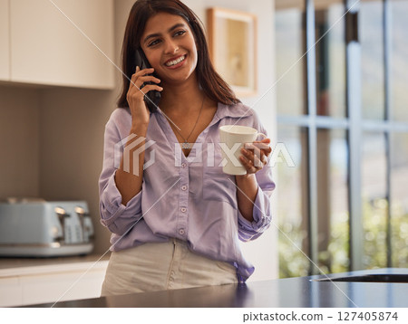 Phone call, kitchen and woman with coffee and smile in morning planning day and talking in home. Communication, conversation and girl drinking coffee or tea on phone to discuss news in apartment. Phone call, kitchen and woman with coffee and smile in morning planning day and talking in home. Communication, conversation and girl drinking coffee or tea on phone to discuss news in apartment. 127405874