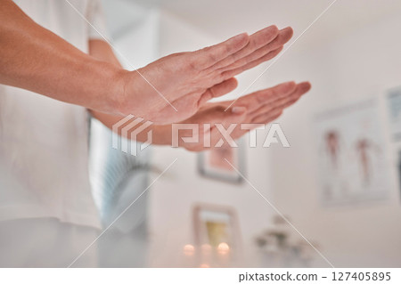 Reiki, massage and spa wellness hands for luxury, relax and peach consultation in physical therapy. Beauty therapist doing a health, body and holistic luxury treatment for calm and healthy zen care 127405895