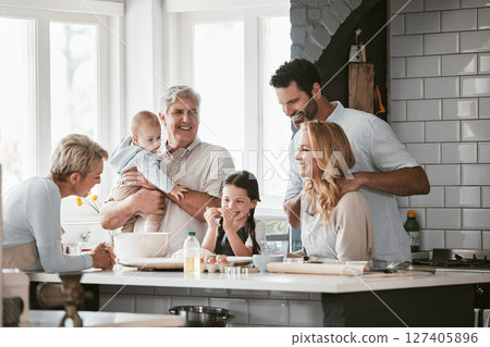 Big family, love and cooking in home kitchen, bonding or having fun. Support, care and grandparents, father and mother, baby and girl baking, learning and talking while enjoying quality time together 127405896