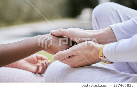 Love, support and mother holding hands with child for trust, safety and hope for foster care or adoption. Hands, diversity and interracial family connect in hope, advice and peace while bonding Love, support and mother holding hands with child for trust, safety and hope for foster care or adoption. Hands, diversity and interracial family connect in hope, advice and peace while bonding 127405923