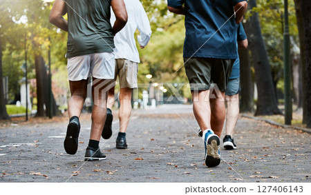 Fitness, men and running club in park, cropped legs in nature for exercise on garden path together. Motivation, workout and friendship, group of senior friends run, health and wellness in retirement. Fitness, men and running club in park, cropped legs in nature for exercise on garden path together. Motivation, workout and friendship, group of senior friends run, health and wellness in retirement. 127406143