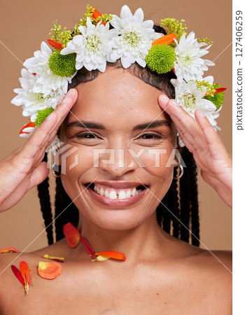 Flower crown, happy black woman and studio portrait for cosmetic makeup, natural beauty and skincare. Floral fashion, model happiness and girl smile on face for flowers, cosmetics or brown background Flower crown, happy black woman and studio portrait for cosmetic makeup, natural beauty and skincare. Floral fashion, model happiness and girl smile on face for flowers, cosmetics or brown background 127406259