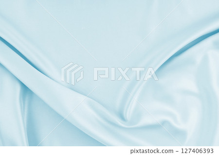 Smooth elegant blue silk can use as background. Smooth elegant blue silk can use as background. 127406393