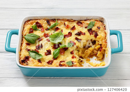 twice baked potato casserole in a baking dish 127406420