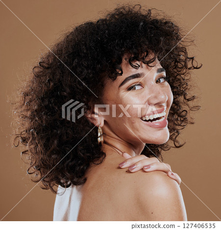 Woman, hair care and skincare for beauty, happy and face makeup, natural cosmetics and smile on brown studio background. Portrait, model and facial foundation, self love and pride of healthy skin Woman, hair care and skincare for beauty, happy and face makeup, natural cosmetics and smile on brown studio background. Portrait, model and facial foundation, self love and pride of healthy skin 127406535