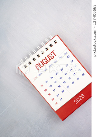 August 2026 on gray color wooden table, Flat lay. 127406665