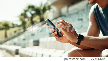 Athlete, hands and phone with man in stadium for running performance, fitness stats and online training plan. Closeup, workout metrics and exercise schedule with person for competition results Athlete, hands and phone with man in stadium for running performance, fitness stats and online training plan. Closeup, workout metrics and exercise schedule with person for competition results 127406684