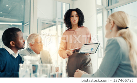 Group presentation, businesswoman and tablet screen with data, investment stats and planning. Meeting, analyst and brainstorming with technology for financial charts, proposal or discussion in office 127406755