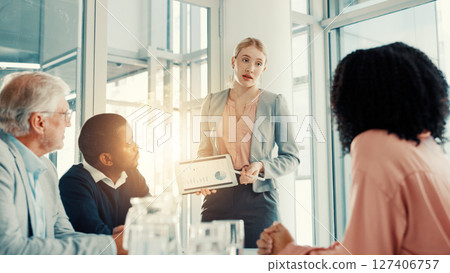 Presentation, business woman and tablet screen with financial data, investment stats and planning. Team meeting, analyst and professional with technology for charts, graphs or discussion in office 127406757