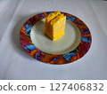 a few slices of orange-flavored sponge cake 127406832