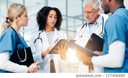 Medical, strategy or tablet with doctors and nurses in hospital together for discussion or report. Collaboration, flare and healthcare with professional medicine team in clinic for diagnosis review 127406889