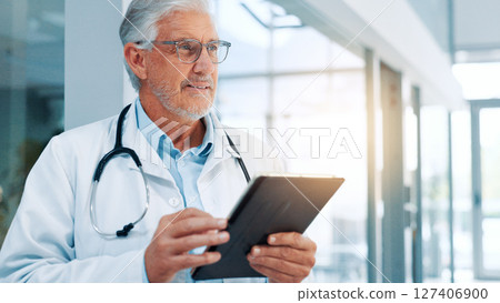 Thinking, doctor or man in hospital, tablet or choice with problem solving, app or research. Healthcare, mature person and medical with professional, tech and planning for shift schedule and internet 127406900