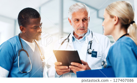 Coaching, medical or tablet with doctors and nurses in hospital together for discussion or report. Collaboration, healthcare and internship with professional medicine team in clinic for diagnosis Coaching, medical or tablet with doctors and nurses in hospital together for discussion or report. Collaboration, healthcare and internship with professional medicine team in clinic for diagnosis 127407086