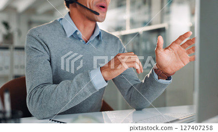 Computer, hands and man with headset in call center for help or online assistance. Communication, contact us and customer service with employee in office for feedback or support as virtual assistant Computer, hands and man with headset in call center for help or online assistance. Communication, contact us and customer service with employee in office for feedback or support as virtual assistant 127407258