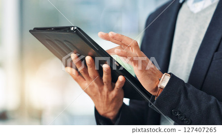 Hands, person and typing on tablet in office for research, financial report and schedule update. Accountant, reading and digital for finance agenda, information and budget review for investment email Hands, person and typing on tablet in office for research, financial report and schedule update. Accountant, reading and digital for finance agenda, information and budget review for investment email 127407265