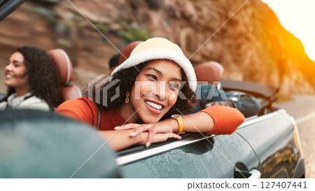 Road trip, smile and thinking with woman in car for friends holiday, travel or vacation. Drive, freedom and vision with group of happy people riding in convertible vehicle for weekend getaway Road trip, smile and thinking with woman in car for friends holiday, travel or vacation. Drive, freedom and vision with group of happy people riding in convertible vehicle for weekend getaway 127407441