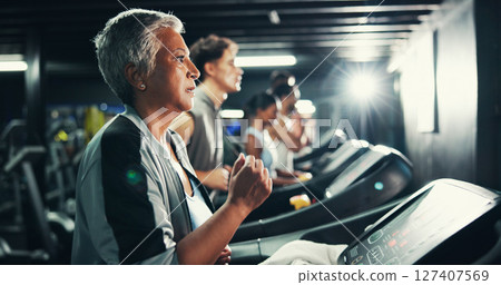 Runner, gym and fitness with woman on treadmill for speed challenge, workout and training. Performance, cardio exercise and wellness with mature person on running machine for endurance and health Runner, gym and fitness with woman on treadmill for speed challenge, workout and training. Performance, cardio exercise and wellness with mature person on running machine for endurance and health 127407569