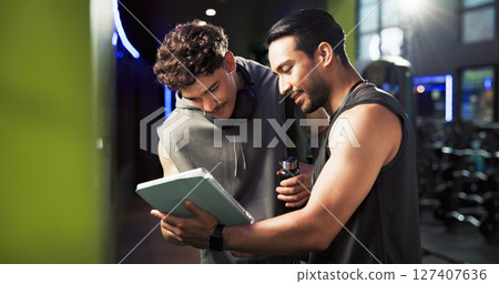Men, personal trainer and tablet with talking at gym with smile, sign up and listening with exercise tips. People, coach and touchscreen with app for training, registration or offer at fitness center Men, personal trainer and tablet with talking at gym with smile, sign up and listening with exercise tips. People, coach and touchscreen with app for training, registration or offer at fitness center 127407636