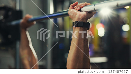 Hands, fitness and man in gym, barbell and training with weightlifting, workout and exercise. Closeup, healthy person and bodybuilder in wellness center, equipment and challenge with power and strong 127407637