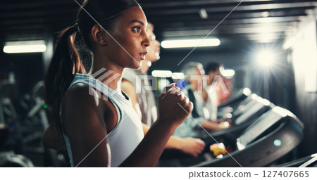 Workout, woman and running on treadmill in gym at night for fitness training, endurance challenge and calorie burning. Breathe, late exercise and girl with energy for intense cardio and race practice Workout, woman and running on treadmill in gym at night for fitness training, endurance challenge and calorie burning. Breathe, late exercise and girl with energy for intense cardio and race practice 127407665
