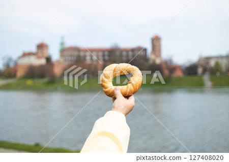 Traditional Obwarzanek Held in Front of Wawel Castle 127408020