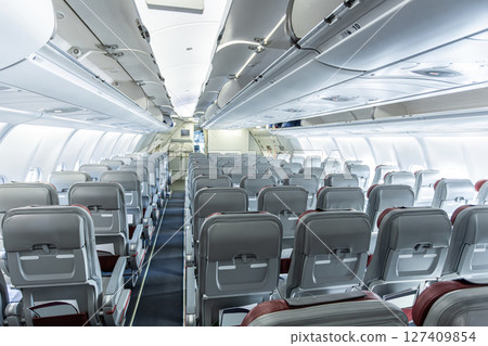 Inside empty wide body passenger plane cabin 127409854