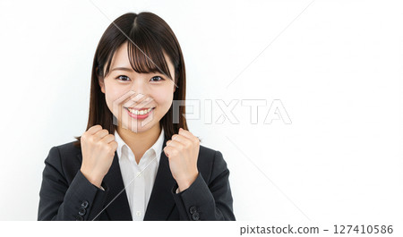 New graduate woman cheering with a fist pump 127410586