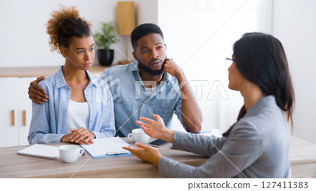 Retirement Planning. African American Spouses Having Investment Consultation In Finansial Counselor's Office. Selective Focus Retirement Planning. African American Spouses Having Investment Consultation In Finansial Counselor's Office. Selective Focus 127411383