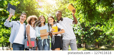 Students Community. Group Of College Friends Posing For Group Photo Outdoors, Holding Workbooks In Hands And Smiling, Empty Space 127411618