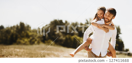 Summer. Happy Father Carrying Daughter Going On Family Picnic In Countryside On Sunny Day After End Of Quarantine. 127411688