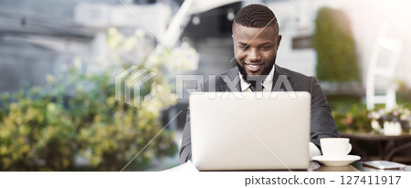 Business People Lifestyle. African American Man Working On Laptop In Outdoor Cafe. Selective Focus, Empty Space 127411917