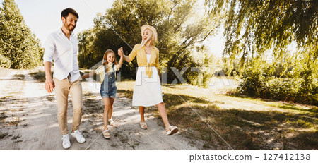 Finally, After-Quarantine Walk. Happy Family Walking Near River In Countryside Spending Summer Day Outdoors. Panorama, Full-Length Finally, After-Quarantine Walk. Happy Family Walking Near River In Countryside Spending Summer Day Outdoors. Panorama, Full-Length 127412138