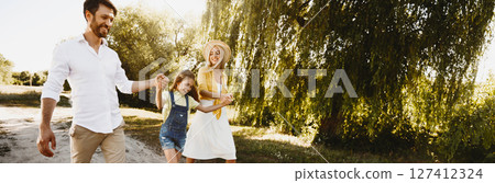 After-Quarantine Walk. Family Going On Picnic Having Fun Walking Near Riverbank Spending Weekend In Nature After Parks Reopening. 127412324