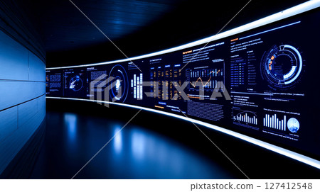 A long wall of information displayed on a wall in a dark room A long wall of information displayed on a wall in a dark room 127412548
