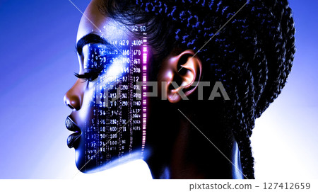 A woman's face with binary code projected on her face 127412659