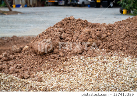 Excavation site action soil pile in construction zone outdoor close-up natural terrain 127413389