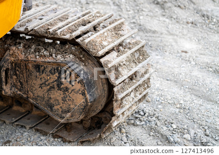 Excavation work progress construction site equipment close-up industrial setting ground level view 127413496