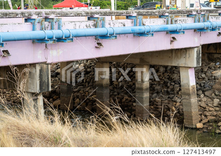 Bridge structural inspection waterfront area urban environment close-up view engineering concept 127413497