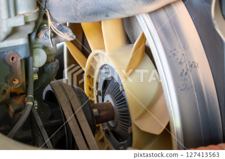 Engine maintenance in industrial garage a close-up view of mechanical concepts Engine maintenance in industrial garage a close-up view of mechanical concepts 127413563