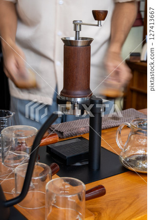 Coffee brewing process coffee shop beverage preparation indoor setting close-up view artisan techniques Coffee brewing process coffee shop beverage preparation indoor setting close-up view artisan techniques 127413667