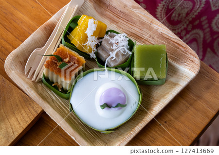 Delicious traditional asian desserts local market food cozy setting close-up culinary experience Delicious traditional asian desserts local market food cozy setting close-up culinary experience 127413669