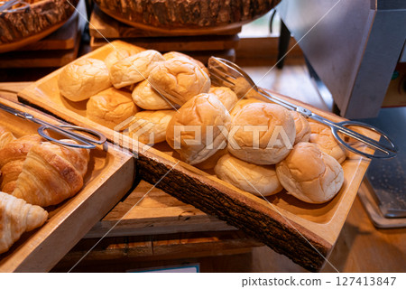 Freshly baked bread rolls bakery food rustic kitchen close-up culinary delights Freshly baked bread rolls bakery food rustic kitchen close-up culinary delights 127413847