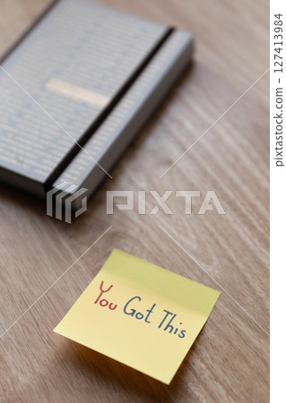 Motivational note desk office space image bright atmosphere close-up inspiration 127413984