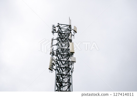 Overcast sky aerial view telecommunication tower enhancements in urban infrastructure and connectivity Overcast sky aerial view telecommunication tower enhancements in urban infrastructure and connectivity 127414011