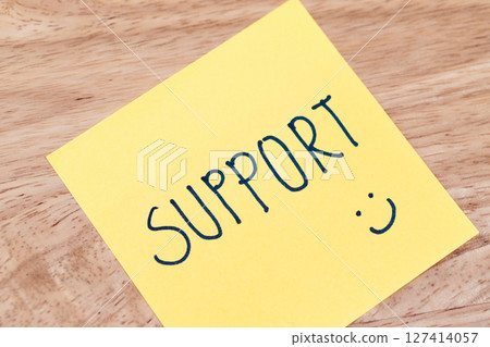 Supportive notes encourage positivity at work office desk indoor close-up conceptual 127414057