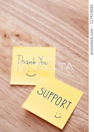 Thank you support notes wooden table positive message cozy home environment close-up view Thank you support notes wooden table positive message cozy home environment close-up view 127414085