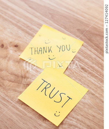 Trust and gratitude sticky notes office desk motivational content bright environment close-up view 127414092