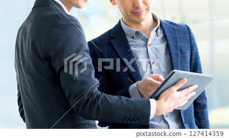 Two Japanese male businessmen having a meeting 127414359
