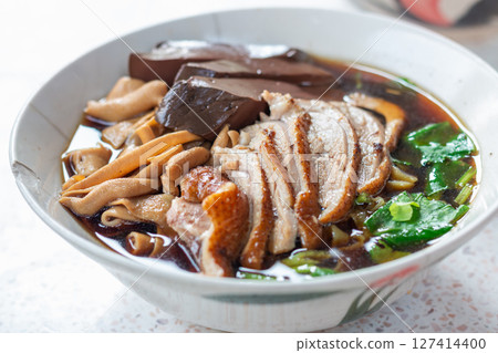 Delicious chinese noodle soup local market food cozy setting close-up shot culinary delight Delicious chinese noodle soup local market food cozy setting close-up shot culinary delight 127414400