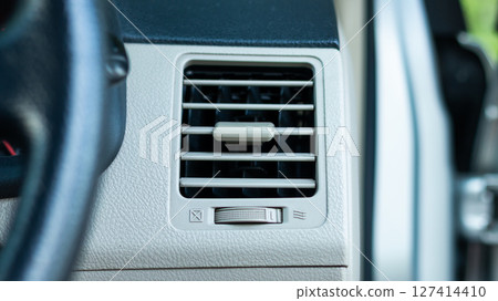 Vehicle interior focus overview of car air conditioning vent system and airflow concept 127414410